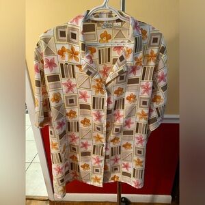 Check out this pretty blouse that is in excellent condition.